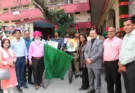 Mrs. Surinder Kaur Amritsar sending off the sweep cycle rally by giving the central flag.