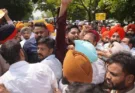 AAP leaders and workers protest against ED raids before elections