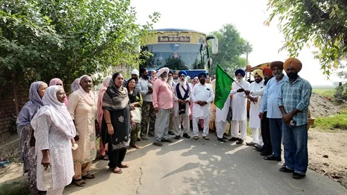 Cabinet Minister Harbhajan Singh ETO flags off the Chief Minister's pilgrimage bus from village Talwandi Dogran