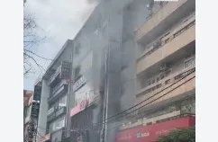 A sudden fire broke out in a three-storey building and its adjoining buildings in the Model Town area of northwest Delhi on Friday.